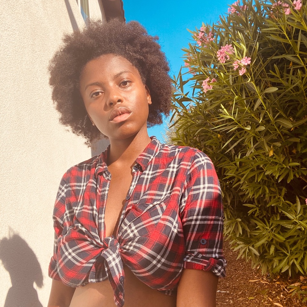 A red flannel crop top